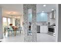 Modern kitchen with stainless steel appliances and light blue cabinets at 1515 Pinellas Bayway S # 70, Tierra Verde, FL 33715