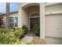 Welcoming front entrance with double doors and decorative wreaths at 315 19Th Nw St, Ruskin, FL 33570