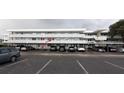 Exterior view of condo building with parking at 4895 Bay Ne St # 211, St Petersburg, FL 33703