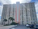 Condo building exterior, featuring parking and landscaping at 4900 Brittany S Dr # 1512, St Petersburg, FL 33715
