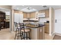 Modern kitchen with granite island and stainless steel appliances at 4900 Brittany S Dr # 1512, St Petersburg, FL 33715