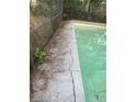 Residential pool with cracked concrete decking needing repair at 5824 58Th Street Ct, Tampa, FL 33619