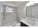 Renovated bathroom, featuring modern vanity and shower at 6220 Westport Dr, Port Richey, FL 34668