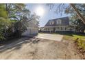 Two-story house with attached garage and large driveway at 7172 Dr Martin Luther King Jr S St, St Petersburg, FL 33705