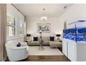 Spacious living room featuring a large sectional sofa and a beautiful view at 7876 Marsh Pointe Dr, Tampa, FL 33635