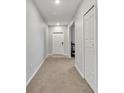 Bright foyer with neutral walls and carpet at 8506 Hunters Fork Loop, Ruskin, FL 33573