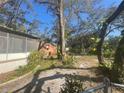 Large backyard with mature trees and open space at 12411 Eagle Lake Ave, New Port Richey, FL 34654