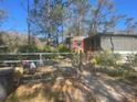 Home with a chain link fence and gated entry at 12411 Eagle Lake Ave, New Port Richey, FL 34654
