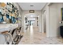 Elegant entryway with tile floors and a modern console table at 12854 Boggy Creek Dr, Riverview, FL 33579