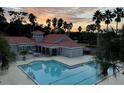 Stunning community pool and clubhouse at sunset at 18001 Richmond Place Dr # 125, Tampa, FL 33647