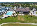 Aerial view of clubhouse, pool, and marina at 2795 Kipps Colony S Dr # 305, St Petersburg, FL 33707
