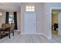 Bright and spacious entryway with wood-look floors at 4909 Willow Ridge Ter, Valrico, FL 33596