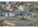 Spacious backyard with a screened enclosure at 4918 Woodland Dr, St Petersburg, FL 33708