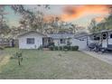 Front view of the house with a well-maintained lawn at 4918 Woodland Dr, St Petersburg, FL 33708