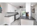 Modern kitchen with white cabinets and granite countertops at 494 Boca Ciega Point N Blvd, St Petersburg, FL 33708