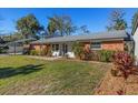 Brick ranch house with side yard at 7226 Alafia Ridge Loop, Riverview, FL 33569