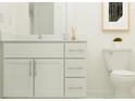 Clean bathroom with white vanity, quartz countertop, and toilet at 10143 Gentle Rain Dr, Land O Lakes, FL 34638