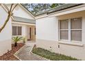 Front entrance with walkway and landscaping at 15890 Sanctuary Dr, Tampa, FL 33647