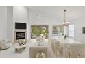 Spacious living room with fireplace and access to backyard at 15890 Sanctuary Dr, Tampa, FL 33647