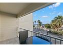 Balcony with table and chairs overlooking ocean at 2506 N Rocky Point Dr # 204, Tampa, FL 33607