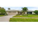 Beautiful single-Gathering home with a well-manicured lawn at 3939 Venetian Way, Tampa, FL 33634