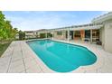 Inviting swimming pool with a large patio area at 3939 Venetian Way, Tampa, FL 33634