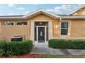 Front entrance with a decorative screen door at 1141 Jameson Greens Dr # 3, Sun City Center, FL 33573
