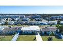 Aerial view of neighborhood with single-Gathering homes at 1518 Chevy Chase Dr, Sun City Center, FL 33573