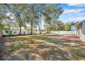 Large backyard with a spacious patio area, perfect for outdoor entertaining at 16116 Sagebrush Rd, Tampa, FL 33618