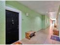 Building hallway with access to unit and seating at 1810 E Palm Ave # 5113, Tampa, FL 33605