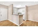 Efficient kitchen with granite countertops and white cabinets at 1810 E Palm Ave # 5113, Tampa, FL 33605