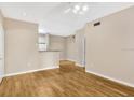 Open living area with wood flooring and kitchen bar at 1810 E Palm Ave # 5113, Tampa, FL 33605