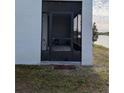 Enclosed screened porch with access from the backyard at 3005 Suncoast Blend Dr, Odessa, FL 33556