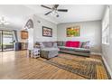 Spacious living room with L-shaped sofa and wood floors at 3411 28Th E St, Bradenton, FL 34208