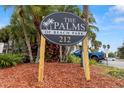 Community sign for The Palms of Beach Park, a complex with lush landscaping and convenient parking at 3817 W Platt St # 306, Tampa, FL 33609