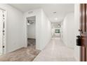 Bright entry hall with tile flooring and carpet, leading to other rooms at 3946 Postmark Lake Pl, Seffner, FL 33584
