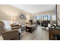 Living room features wood-look floors and comfortable seating at 6219 Palma Del Mar S Blvd # 114, St Petersburg, FL 33715