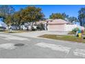 Residential home on a tree-lined street with a fire hydrant at 10215 Evening Trail Dr, Riverview, FL 33569