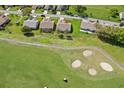 Property location shown from above, near a golf course at 11143 Sun Tree Rd, Hudson, FL 34667