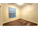 Spacious bedroom with brown carpet and window blinds at 19130 Wood Sage Dr, Tampa, FL 33647