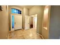 Bright entryway with tile floors and neutral colors at 19130 Wood Sage Dr, Tampa, FL 33647