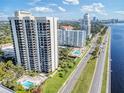 Highrise building and surrounding area, showcasing waterfront location and pool at 2413 Bayshore Blvd # 404, Tampa, FL 33629