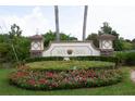Key Vista community entrance sign with landscaping at 2749 Plantain Dr, Holiday, FL 34691