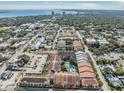 An aerial view showcasing the community's layout, amenities, and its proximity to a body of water and the cityscape at 410 S Armenia Ave # 926, Tampa, FL 33609