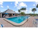 Community pool with ample deck space for relaxation at 4366 Summersun Dr, New Port Richey, FL 34652