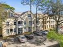 Two-story building with parking and landscaping at 5041 Sunridge Palms Dr # 103, Tampa, FL 33617