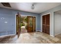 Bright entryway with tile flooring and a view to backyard at 531 Garrard Dr, Temple Terrace, FL 33617