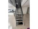 Modern staircase leading to the upper level at 7638 Woodbridge Blvd, Tampa, FL 33615