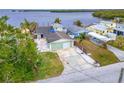 Waterfront property boasting a single-story home and private driveway at 1022 Canal St, Ruskin, FL 33570