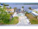 Charming waterfront home with a detached garage and spacious yard at 1022 Canal St, Ruskin, FL 33570